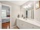 Bright bathroom with white cabinets, a view into the bedroom, and modern fixtures at 7 Seahorse Ct, Isle of Palms, SC 29451