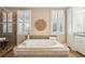 Elegant bathroom features a large soaking tub, plantation shutters, and a separate glass-enclosed shower at 7 Seahorse Ct, Isle of Palms, SC 29451