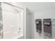 Clean bathroom features a modern shower-tub combo with tile surround and neutral accents at 7 Seahorse Ct, Isle of Palms, SC 29451