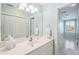 Bathroom featuring white vanity, modern lighting, and tile floors extending into an adjacent room at 7 Seahorse Ct, Isle of Palms, SC 29451