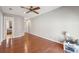 A spacious bedroom features hardwood floors and a ceiling fan with good natural light at 7 Seahorse Ct, Isle of Palms, SC 29451