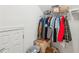 Walk-in closet with hanging clothes, overhead shelf and storage boxes at 7 Seahorse Ct, Isle of Palms, SC 29451