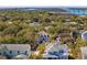 A home with a welcoming front porch surrounded by mature trees and landscaping in a neighborhood by the water at 7 Seahorse Ct, Isle of Palms, SC 29451
