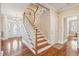 Entryway foyer with hardwood floors, staircase and decorative front door creates a warm welcome at 7 Seahorse Ct, Isle of Palms, SC 29451