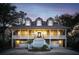 Stunning two-story home with double porches, dormers, and a well-manicured front yard at 7 Seahorse Ct, Isle of Palms, SC 29451