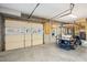 Spacious garage featuring block walls, a golf cart, and second-story loft access at 7 Seahorse Ct, Isle of Palms, SC 29451