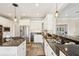 Modern kitchen features stainless steel appliances, granite countertops, and a gas cooktop island at 7 Seahorse Ct, Isle of Palms, SC 29451