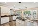 Spacious kitchen with a center island, stainless steel appliances, and adjacent sitting area at 7 Seahorse Ct, Isle of Palms, SC 29451
