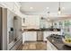 Well-lit kitchen with stainless steel appliances, dark granite countertops, and a gas cooktop at 7 Seahorse Ct, Isle of Palms, SC 29451