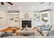 Inviting living room featuring built-in bookcases, a fireplace with a marble surround, and comfortable seating at 7 Seahorse Ct, Isle of Palms, SC 29451