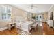 Spacious main bedroom with hardwood floors, a ceiling fan and a sitting area with access to a balcony at 7 Seahorse Ct, Isle of Palms, SC 29451