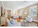 Spacious main bedroom with sitting area, ceiling fan, and natural light at 7 Seahorse Ct, Isle of Palms, SC 29451