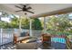 Relaxing screened porch with cushioned seating and view of the private swimming pool at 7 Seahorse Ct, Isle of Palms, SC 29451