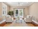 Sitting area with a ceiling fan, hardwood floors, and access to an outdoor balcony at 7 Seahorse Ct, Isle of Palms, SC 29451