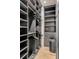 Spacious walk-in closet with custom shelving and ample storage space at 71 Wentworth St # 302, Charleston, SC 29401