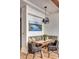 Charming dining area featuring a built-in bench, wooden table, and modern light fixture at 71 Wentworth St # 302, Charleston, SC 29401