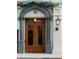 Grand entrance featuring a beautiful arched door, decorative columns, and lantern lighting at 71 Wentworth St # 302, Charleston, SC 29401