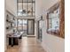 Entryway features a hardwood floor, a table and decor items, and a decorative mirror on the wall at 71 Wentworth St # 302, Charleston, SC 29401
