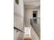 Stylish hallway with modern railing and smooth walls leading upstairs at 71 Wentworth St # 302, Charleston, SC 29401