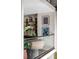 Interior shot featuring modern shelving, plants, and a glass-railed mezzanine at 71 Wentworth St # 302, Charleston, SC 29401