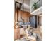 Modern kitchen showcasing wood paneling, stainless appliances, a marble island, and a staircase leading to a loft at 71 Wentworth St # 302, Charleston, SC 29401
