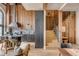 Open-concept kitchen featuring sleek countertops, modern cabinetry, and a stylish island with bar seating, enhanced by natural wood accents at 71 Wentworth St # 302, Charleston, SC 29401