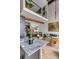 Open-concept living space with loft area above, featuring a kitchen island and comfortable seating at 71 Wentworth St # 302, Charleston, SC 29401