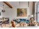 Open-concept living area featuring a large arched window, hardwood floors, and stylish decor at 71 Wentworth St # 302, Charleston, SC 29401