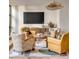 Cozy living room with patterned rug, and comfortable chairs arranged around a wooden center table at 71 Wentworth St # 302, Charleston, SC 29401