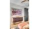 Stylish living room featuring a modern TV, dresser and hardwood floors at 71 Wentworth St # 302, Charleston, SC 29401