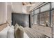 Comfortable bedroom featuring a ceiling fan, large windows with brick views, and closet, offering ample storage at 71 Wentworth St # 302, Charleston, SC 29401