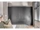 Bedroom with an upholstered headboard, built-in storage, and a large window with an exterior view at 71 Wentworth St # 302, Charleston, SC 29401