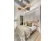 Inviting bedroom with a ceiling fan, neutral color palette, and a king-size bed featuring a decorative throw at 71 Wentworth St # 302, Charleston, SC 29401