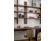 Bright home office with custom shelves, a wooden desk and a neutral chair at 71 Wentworth St # 302, Charleston, SC 29401