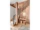 Elegant staircase with wooden steps, rustic wood wall panels, and metal railings at 71 Wentworth St # 302, Charleston, SC 29401