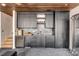 Home wet bar area with premium wood cabinets, wine storage and marble countertops at 71 Wentworth St # 302, Charleston, SC 29401