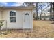 Exterior back entrance featuring a glass window door and tan siding at 7629 Vanderbrook Pl, North Charleston, SC 29420