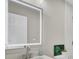 Modern bathroom with large, illuminated mirror, white vanity, and walk in shower at 7629 Vanderbrook Pl, North Charleston, SC 29420