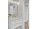 Charming bathroom with white vanity, elegant faucet, and view into the adjacent hallway at 7629 Vanderbrook Pl, North Charleston, SC 29420
