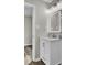 Bathroom featuring a large, illuminated mirror, sleek vanity, and modern lighting at 7629 Vanderbrook Pl, North Charleston, SC 29420