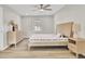 Cozy bedroom with neutral walls, light wood floors, large bed, dresser and ample natural light at 7629 Vanderbrook Pl, North Charleston, SC 29420