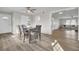 Bright dining room with hardwood style floors near the living room at 7629 Vanderbrook Pl, North Charleston, SC 29420