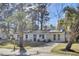 Inviting single-story home with a well-maintained lawn and a spacious driveway leading to the residence at 7629 Vanderbrook Pl, North Charleston, SC 29420