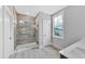 Modern bathroom with a glass-enclosed shower, tile accents, and bright natural light at 782 Blueway Ave, Summerville, SC 29486