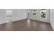 This primary bedroom features hardwood floors, a modern ceiling fan, and natural light from multiple large windows at 782 Blueway Ave, Summerville, SC 29486
