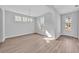 Well-lit dining space with three windows, a front door, and light gray walls at 782 Blueway Ave, Summerville, SC 29486