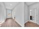 Bright hallway featuring wood floors, a front door, and access to a bathroom at 782 Blueway Ave, Summerville, SC 29486