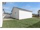 New white shed in backyard with a clean design and a well-manicured lawn at 782 Blueway Ave, Summerville, SC 29486