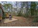 Large backyard featuring a rustic patio area with outdoor seating at 8262 Fairview Nursery Rd, Hollywood, SC 29449