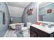 Charming bathroom with clawfoot tub, modern vanity and gray walls at 8262 Fairview Nursery Rd, Hollywood, SC 29449
